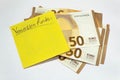 Vacation funds. having the money. stack of 50 euros yellow sticky note Royalty Free Stock Photo