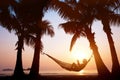 Vacation in hammock on beautiful sunset beach, holiday concept Royalty Free Stock Photo