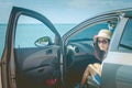 Vacation and Holiday Concept : Happy family car trip at the sea, Portrait woman wearing sunglasses and feeling happiness. Royalty Free Stock Photo