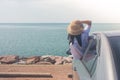 Vacation and Holiday Concept : Happy family car trip at the sea, Portrait woman wearing weave hat and feeling happiness. Royalty Free Stock Photo