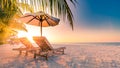 Vacation holidays background wallpaper, two beach lounge chairs under tent on beach. Beach chairs, umbrella and palms on the beach Royalty Free Stock Photo