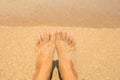 Vacation holidays. Woman feet closeup of girl relaxing on beach Royalty Free Stock Photo