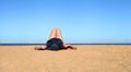 Relaxing holidays. Woman in a hat closeup relaxing on beach on a sand, having a sunbed, enjoying sun on sunny summer day Royalty Free Stock Photo