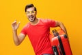 Vacation man background suitcase trip journey studio flight yellow travel baggage traveler happy Royalty Free Stock Photo