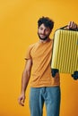 Suitcase man vacation young trip happy yellow tourist holiday journey travel person Royalty Free Stock Photo