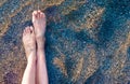 Vacation on ocean beach, feet on sea sand Royalty Free Stock Photo