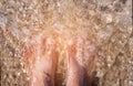 Vacation on ocean beach, male feet on sea sand Royalty Free Stock Photo