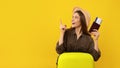 Traveler Lady Holding Travel Tickets Pointing Finger Aside, Yellow Background Royalty Free Stock Photo