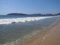 Vacation panorama of sandy beach at bay of ACAPULCO city in Mexico and white waves of Pacific Ocean landscape Royalty Free Stock Photo