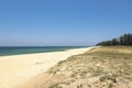 .Beautiful tropical beach, soft wave hitting sandy beach under bright sunny day Royalty Free Stock Photo