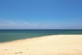 Beautiful tropical beach, soft wave hitting sandy beach under bright sunny day Royalty Free Stock Photo