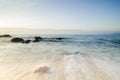 Beautiful tropical beach, soft wave hitting sandy beach under brighter sunny day Royalty Free Stock Photo