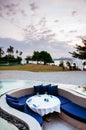 Vacation Relaxation sunken lounge seat in infinity pool tropical