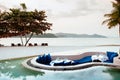 Vacation Relaxation sunken lounge seat in infinity pool tropical nature view, Phuket Thailand