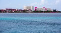 Pink and white resort buildings on coastline