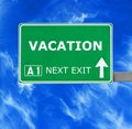 VACATION road sign against clear blue sky Royalty Free Stock Photo