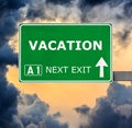 VACATION road sign against clear blue sky Royalty Free Stock Photo