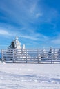 Vacation rural winter background with fence, snow