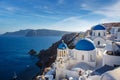 Vacation on Santorini island, Travel to Greece. The blue dome of the white church near the sea and caldera. Royalty Free Stock Photo
