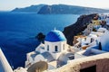 Vacation on Santorini island, Travel to Greece. The blue dome of the white church near the sea and caldera. Royalty Free Stock Photo