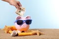 Vacation savings, travel money planning, Piggybank beach vacation