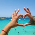 Vacation sea vacation tourism travel weekend happiness hand holds manicure blue lagoon malta beach Royalty Free Stock Photo