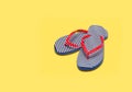 Vacation season - the concept. Beach flip flops on a yellow background. Royalty Free Stock Photo