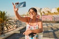 Vacation, selfie and happy senior woman in retirement riding a scooter on the beach promenade. Happiness, smile and Royalty Free Stock Photo