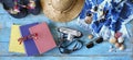 Vacation and summer holidays, flat lay with books, camera, flip flops, seashells, sunglasses, beach towel, straw hat