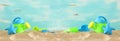 Vacation and summer image with beach colorful toys for kid over the sand. banner