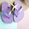 vacation and summer image with purple flipflops over pastel background