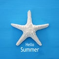 vacation and summer image with starfish over blue wooden background. Royalty Free Stock Photo