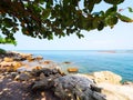 Vacation in summer sea with beach rocks, branch of trees and blue sea in asia.