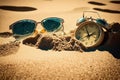 Vacation time. Alarm clock on the sand with sun glasses AI generation