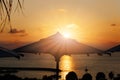 Vacation time: Amazing dawn with parasol and palms Royalty Free Stock Photo