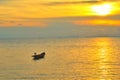 Vacation time concept, A boat going and parking in the sea with sunset time or golden time and cloud.