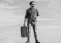 Vacation time. Travel agency. Business trip. Handsome guy traveler. Travel with luggage. Guy outdoors with vintage Royalty Free Stock Photo