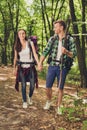 Vacation together. Happy young couple hiking in the woods, holdings hands, smiling, posing for a family portrait for memories, goo Royalty Free Stock Photo