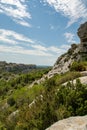 Vacation tourist destination in France, Alpilles mountains gorge in Provence, green pine forests and white stones Royalty Free Stock Photo