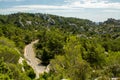 Vacation tourist destination in France, Alpilles mountains gorge in Provence, green pine forests and white stones Royalty Free Stock Photo