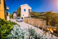 Vacation travel with car concept. Rental hired car in the narrow picturesque street of small greek town. Discover Mediterranean Royalty Free Stock Photo