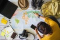 Vacation travel planning concept with map. Overhead view of equipment for travelers. Travel concept background, Young woman