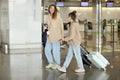 Vacation Trip. Portrait Of Happy Young Family Posing At Airport, mom And Little Daughter With Suitcases At Terminal Royalty Free Stock Photo