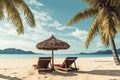 Beach chairs, umbrella and palms on the beach. Royalty Free Stock Photo