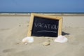 Vacation written on a board