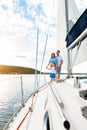 Family Sailing Relaxing During Yacht Ride Standing On Deck, Vertical