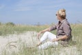 Vacationer sitting on the beach