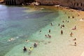 Vacationers bathe and sunbathe against the background of the ancient fortress wall Alanya, Turkey