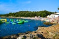 Vacationers on the free stony and pebble Ambrela beach of the Adriatic Sea on a summer sunny day. Pula, Croatia