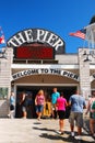 Vacationers head towards the  Pier on a sunny summerÃ¢â¬â¢s day Royalty Free Stock Photo